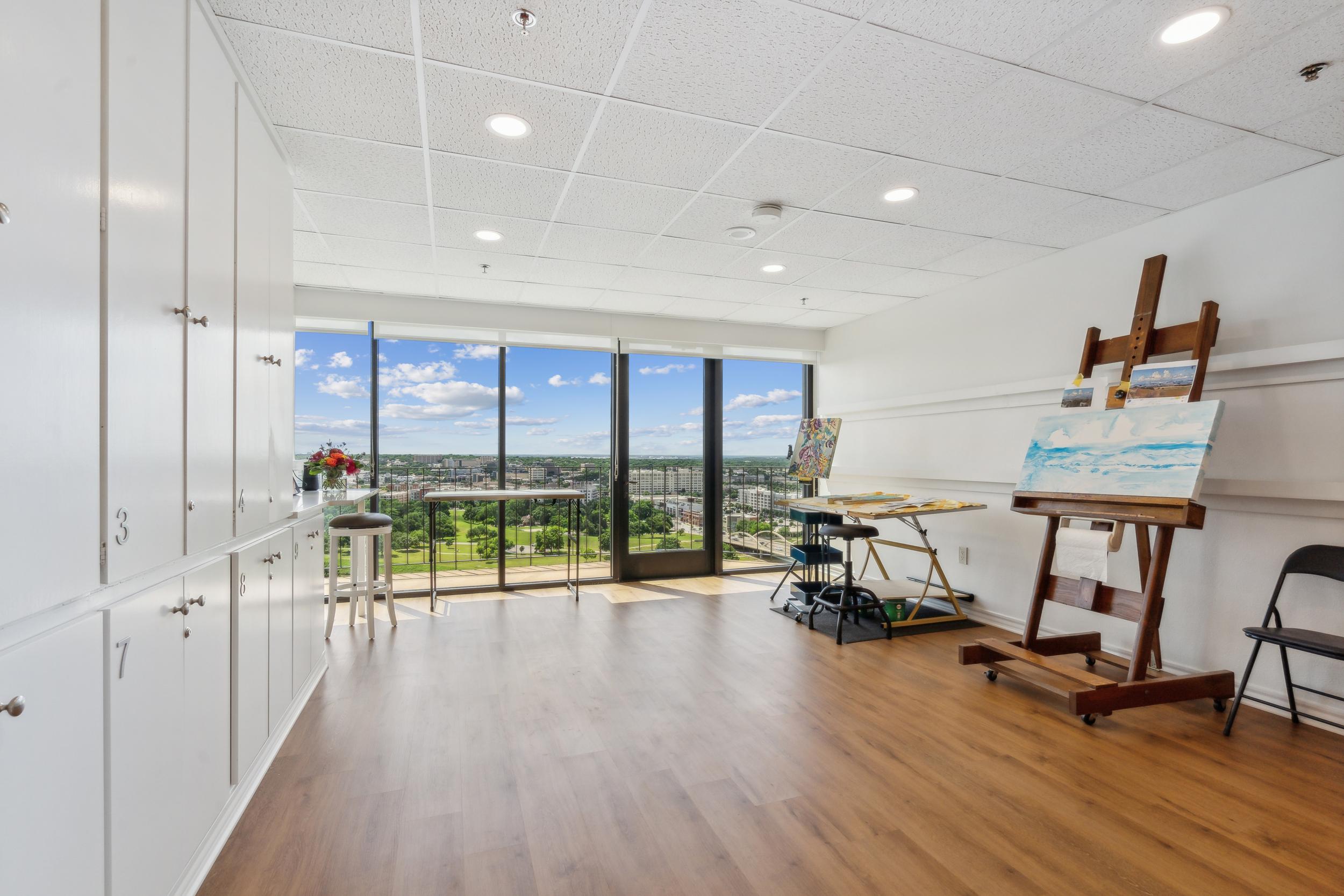 An art studio with floor-to-ceiling windows at Trinity Terrace.