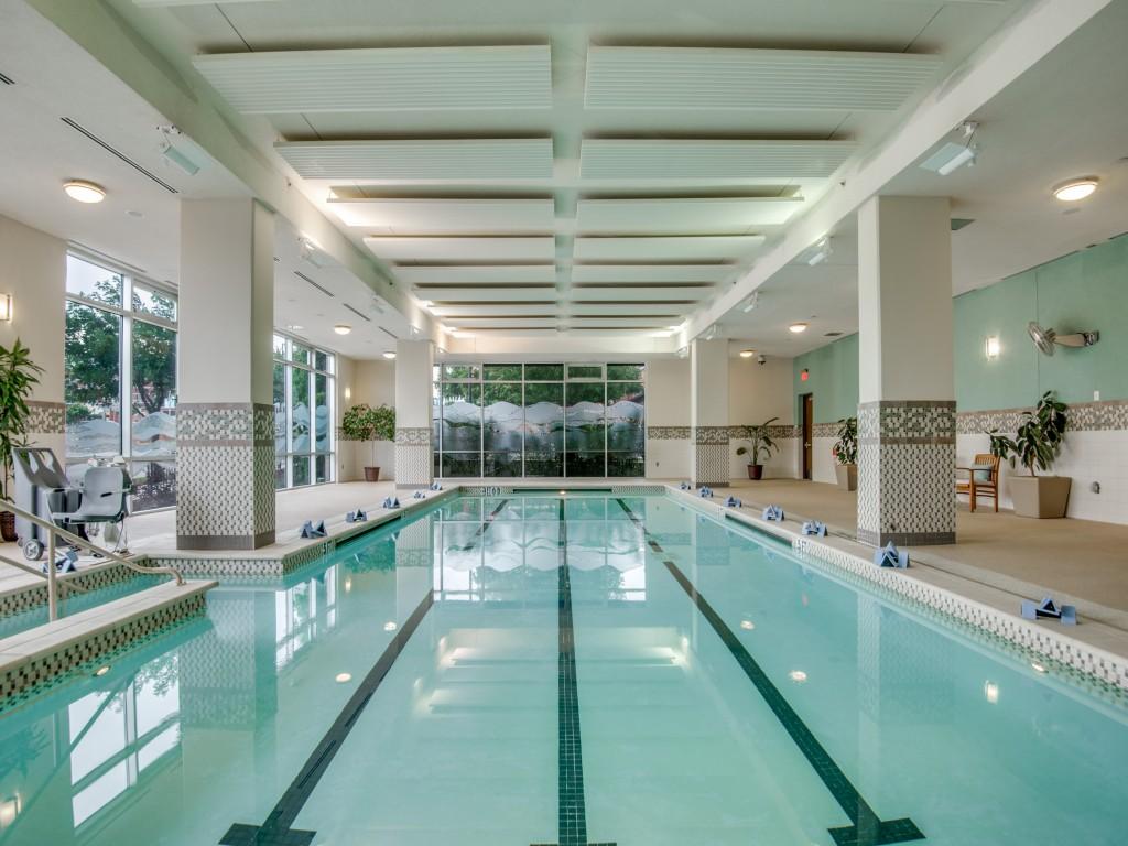 A lap pool with teal accents at Trinity Terrace.