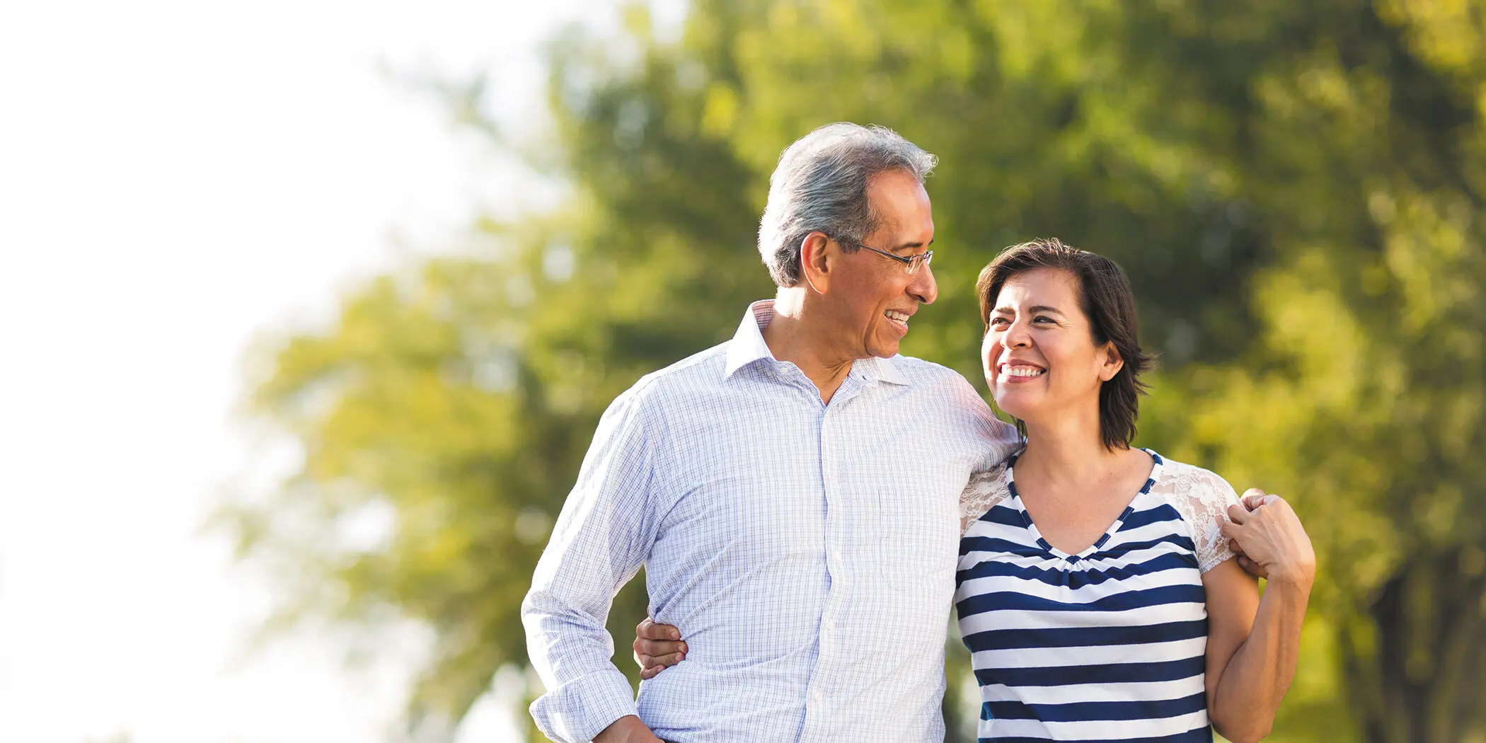 A happy older couple on a walk.